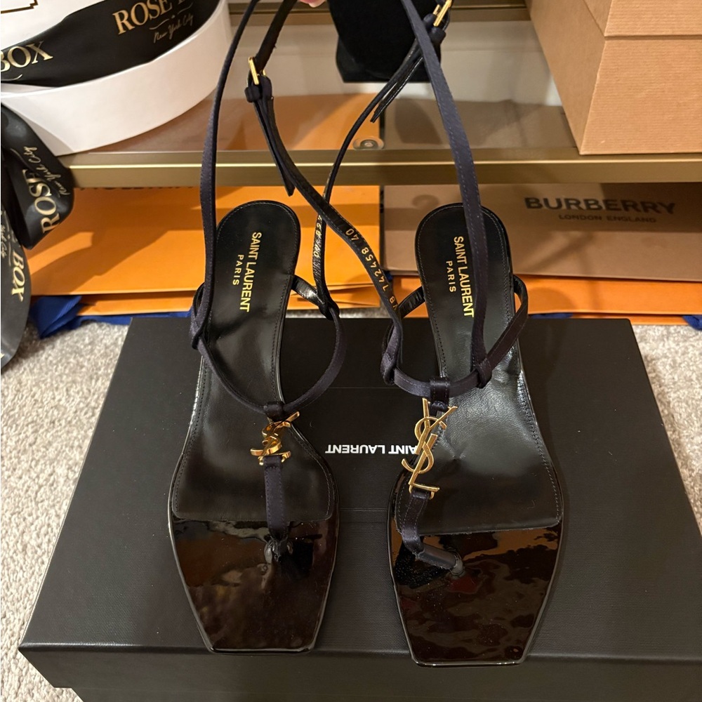 Saint Laurent Cassandra Black Heeled Sandals with Gold Accent